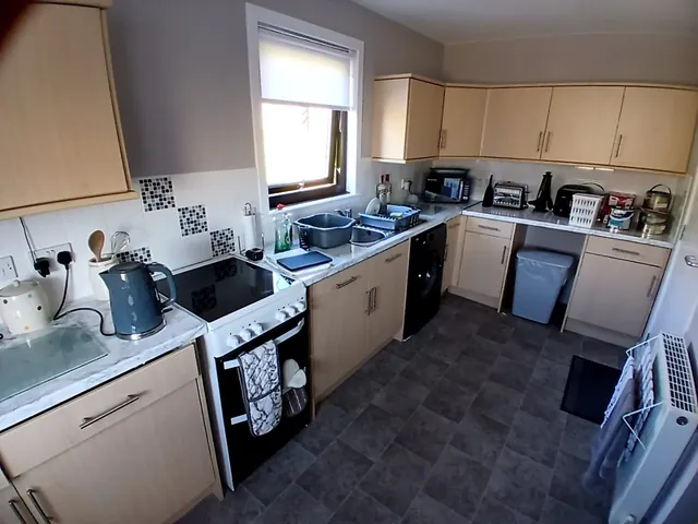Before: oak-effect kitchen cupboards