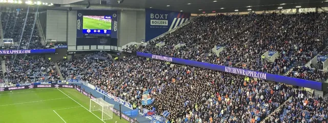 Kitchenwrapper.com on the boards along a packed stand during the match